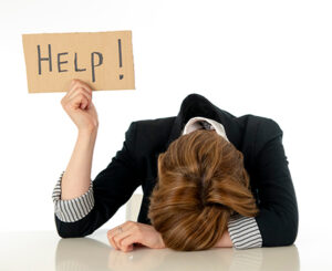 Finding an Faith-Based Online Counselor - Women Holding up a "Help" Sign