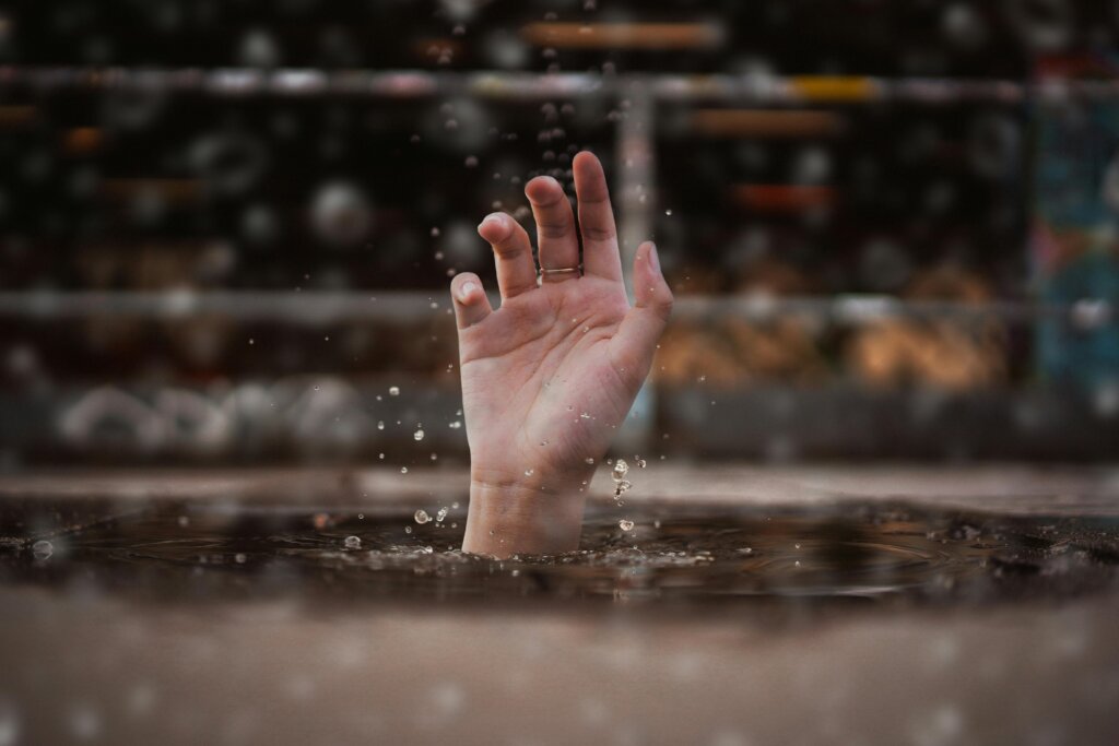 Free online christian counseling help. Picture of hand reaching out of water