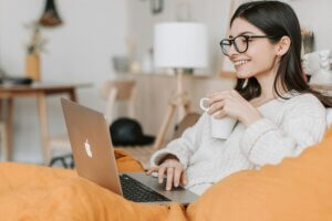 Woman smiling looking at her computer